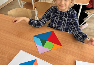 Dziewczynka i jej ułozony tangram.